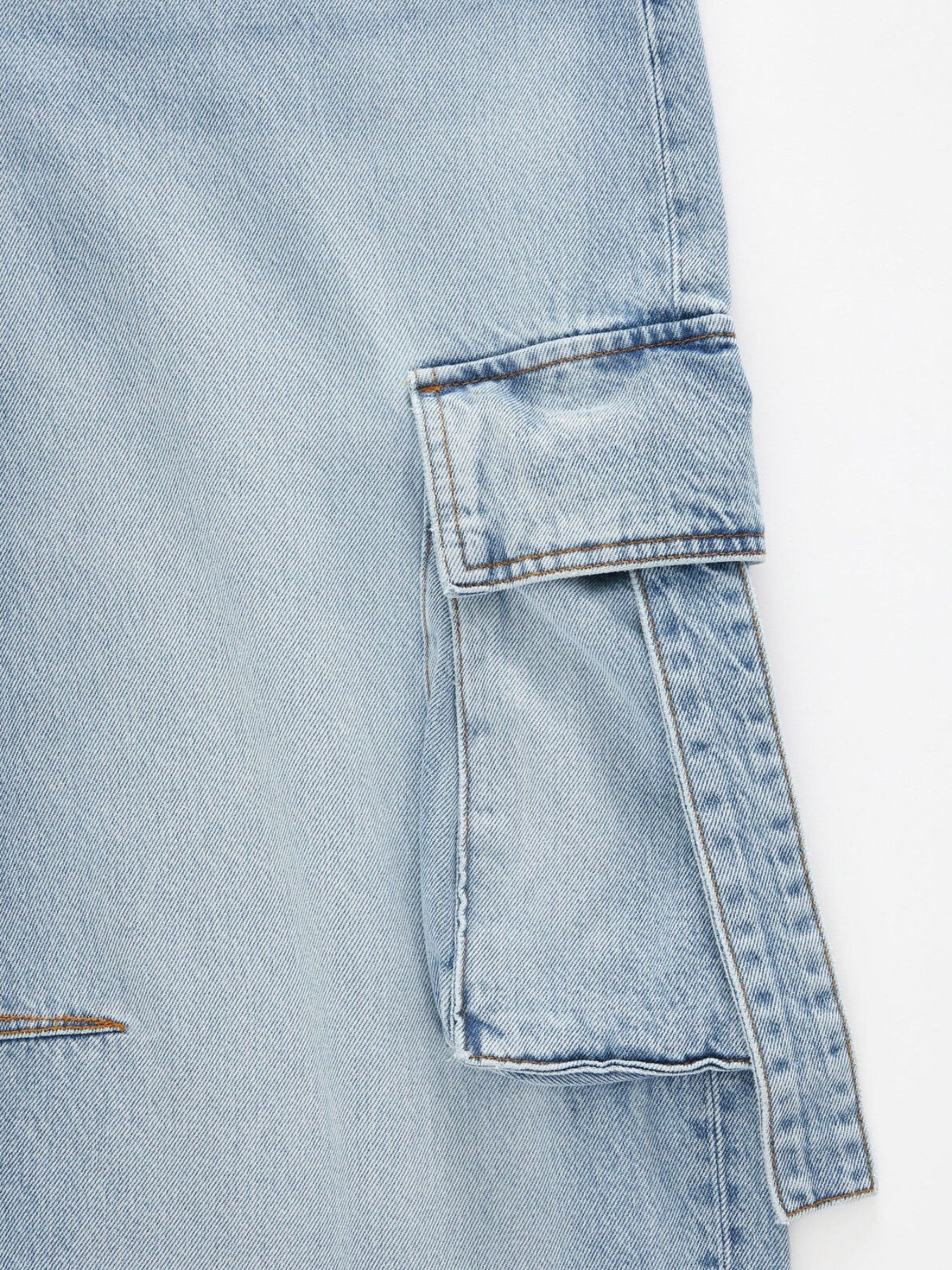 Light blue denim maternity cargo jeans with flap pocket detail