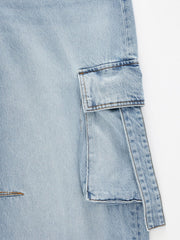 Light blue denim maternity cargo jeans with flap pocket detail