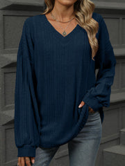 Dark Navy textured ribbed v-neck blouse with blouson sleeves and a relaxed fit.