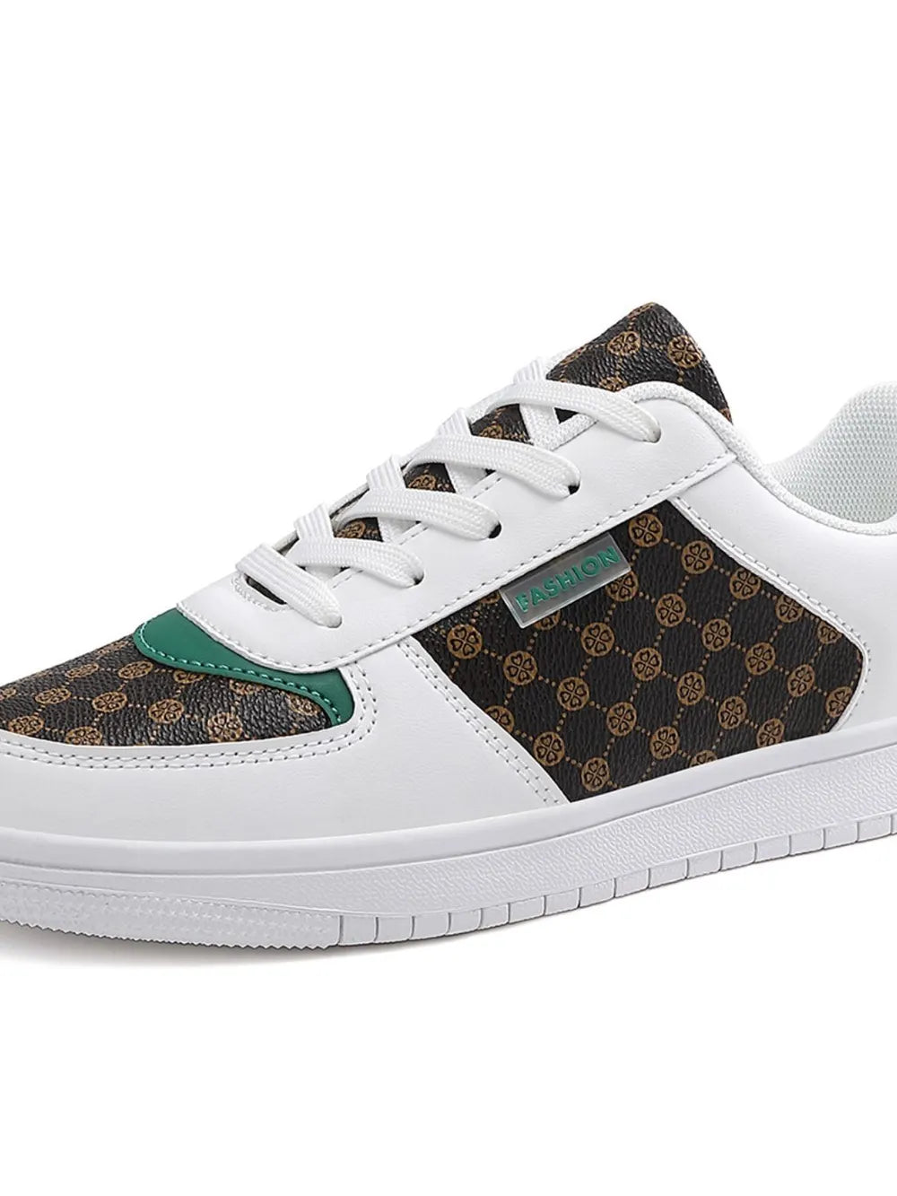 Brown patterned panel court sneakers with white laces and green accents.
