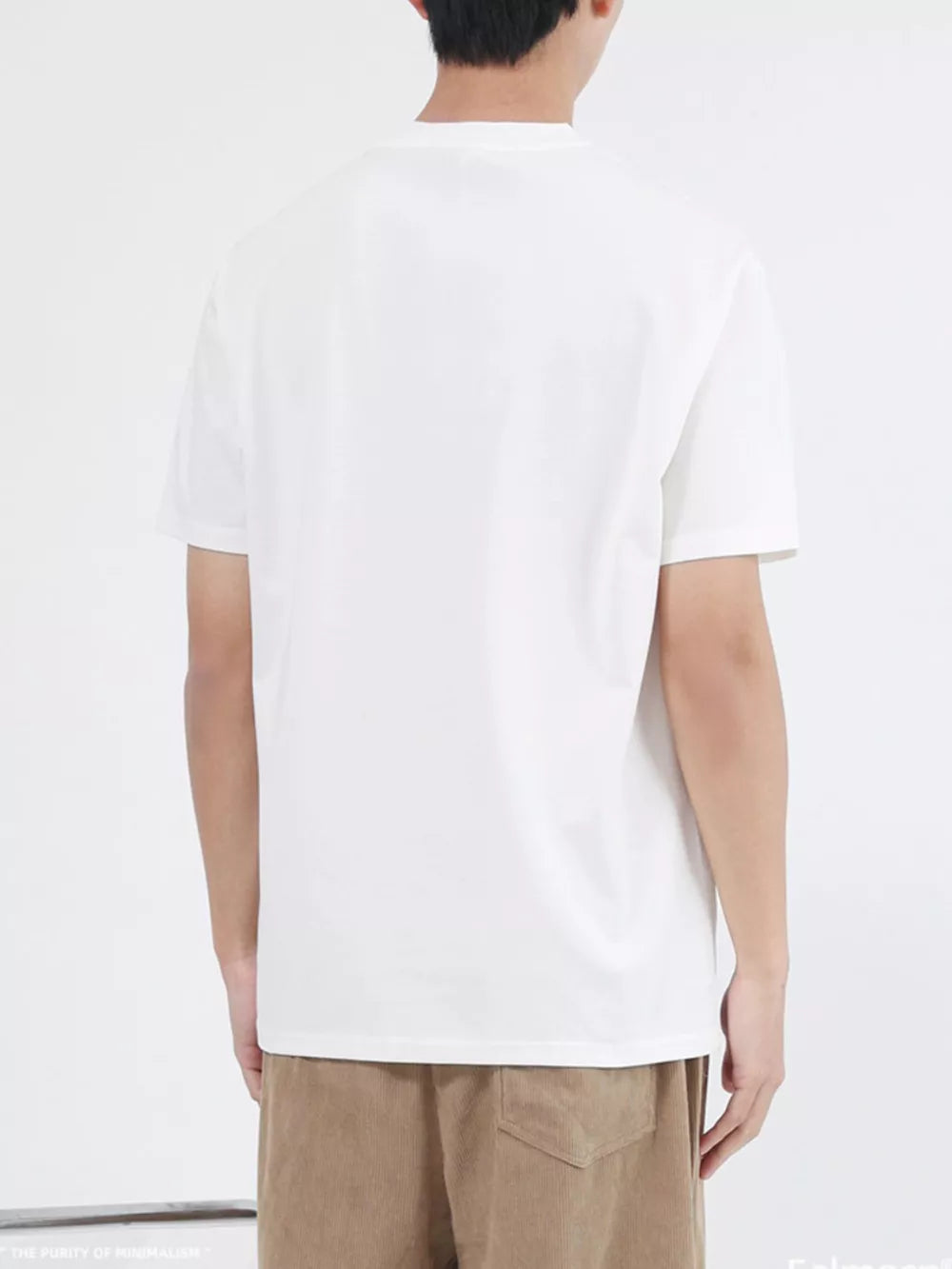 White cotton crew neck t-shirt with short sleeves, back view.