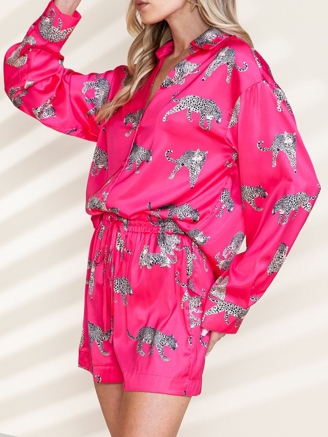 Hot pink silk pajama set with leopard print, button-up shirt and drawstring shorts.