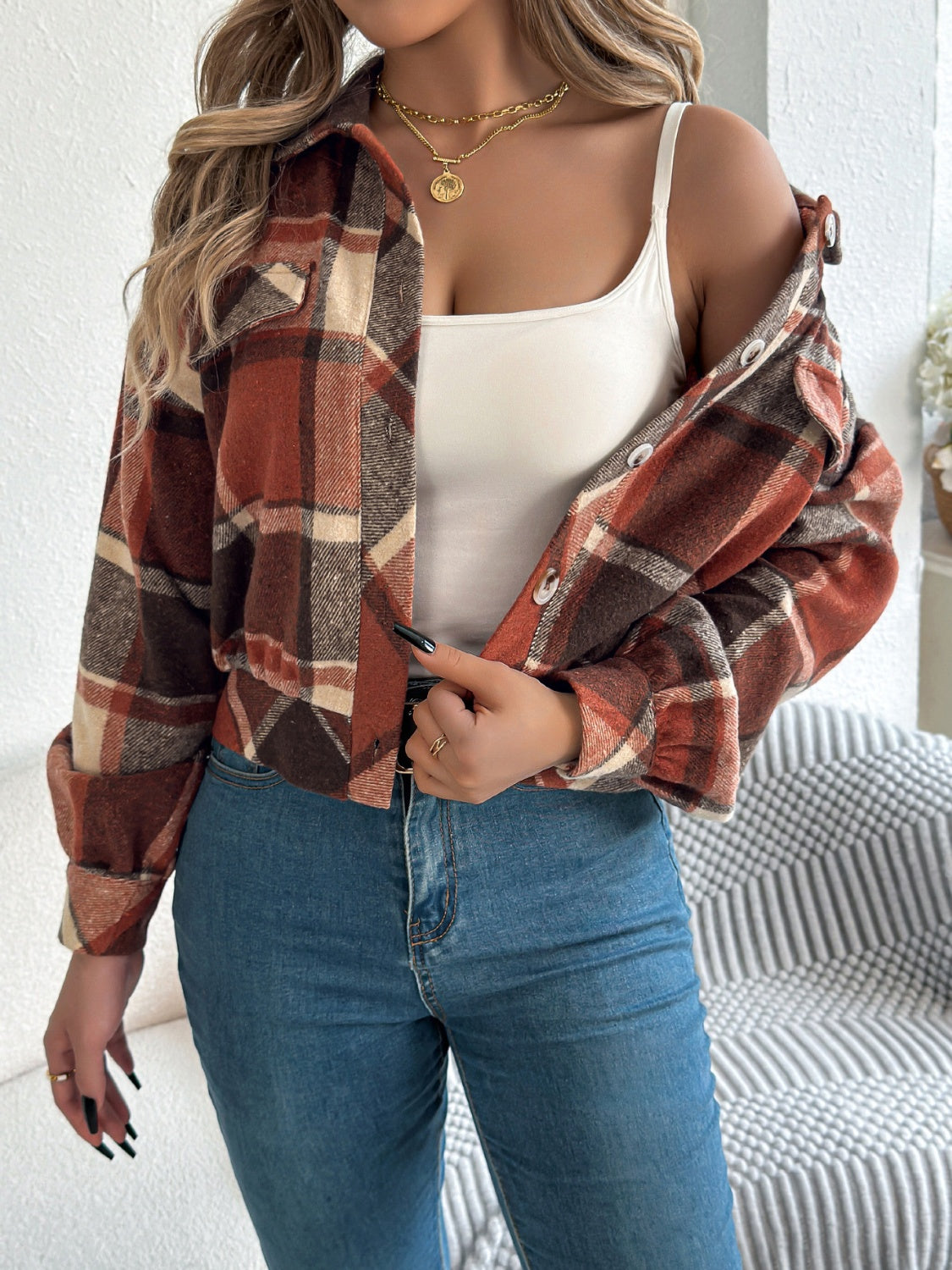 Cropped plaid shacket in terracotta with gathered sleeves and button front.