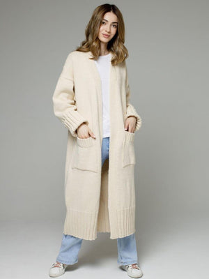 Cream oversized ribbed-trim maxi cardigan with pockets and cuffed sleeves.