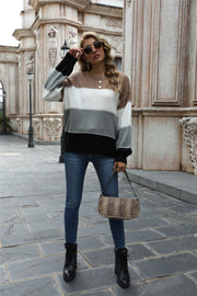 Crewneck knit sweater with horizontal color blocks in brown, white, gray, and black acrylic.