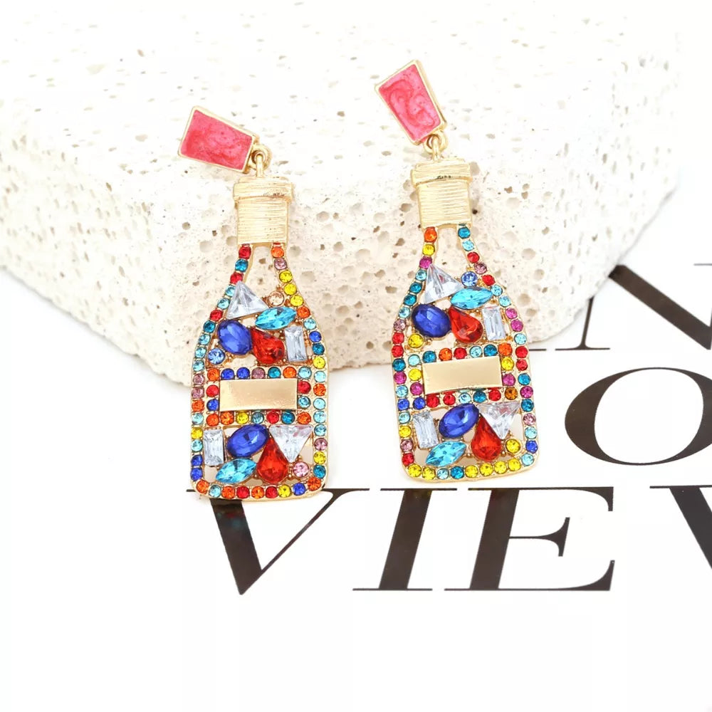 Color mixing champagne bottle drop earrings with colorful rhinestones and gold accents.