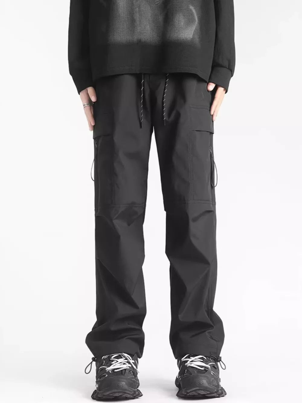Men's black relaxed fit cargo sweatpants with ankle drawstrings and adjustable waist.