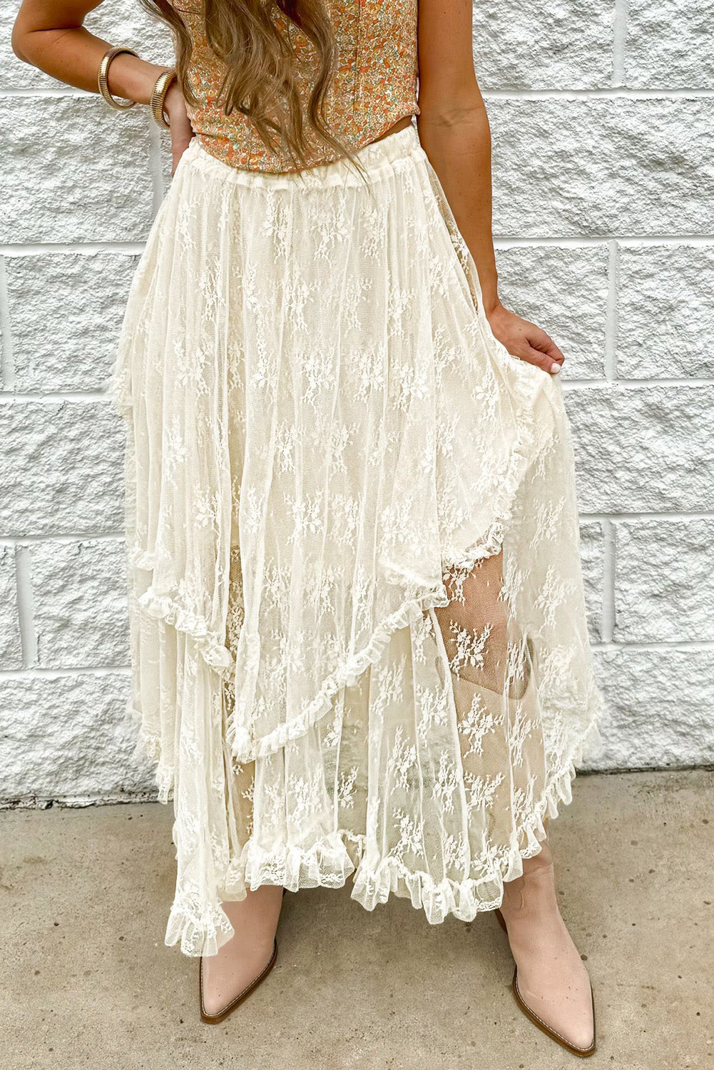 Ivory lace midi skirt with ruffled tiers and a tiered hem.