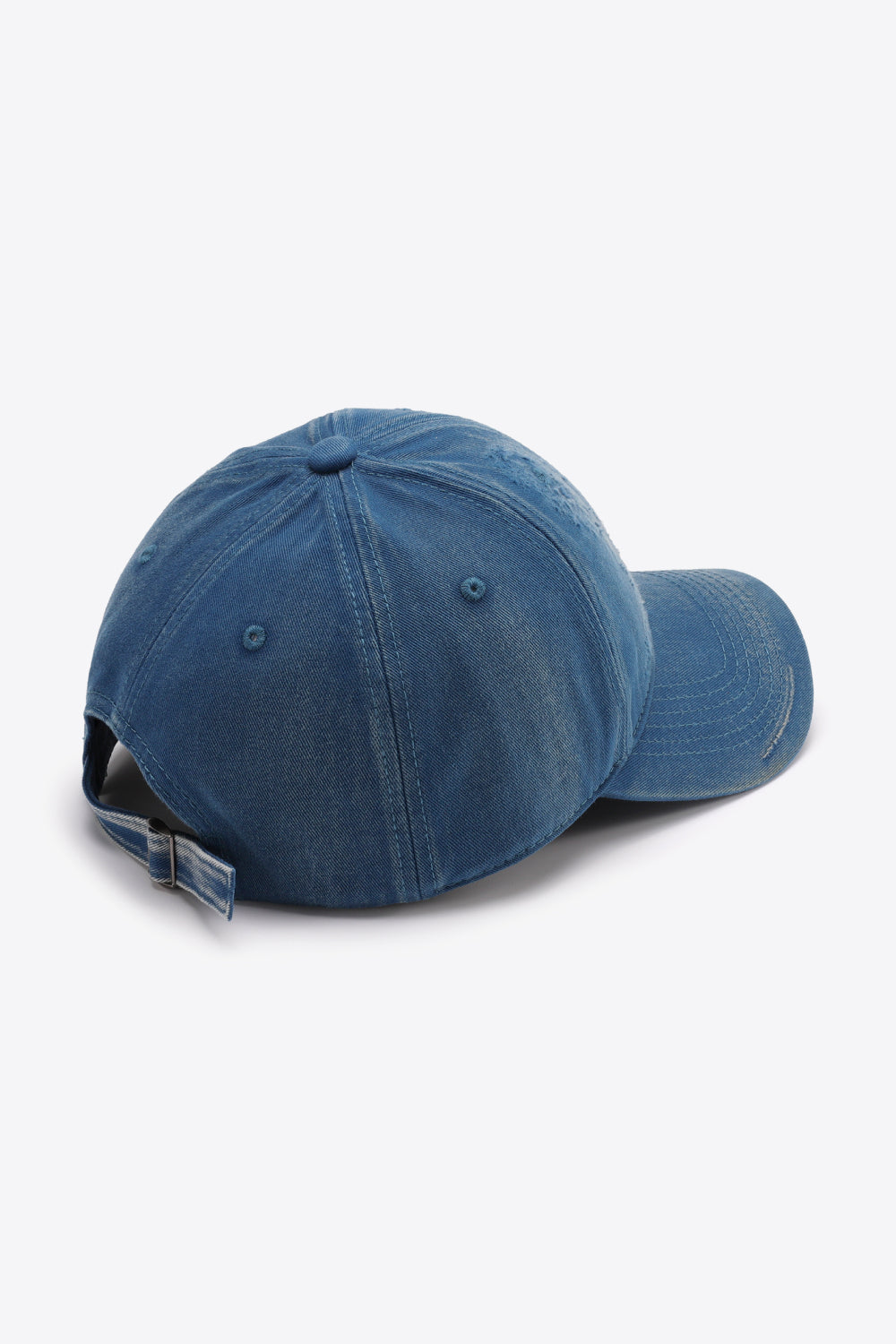 Blue denim baseball cap with distressed details and adjustable strap