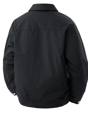 Black snap-down jacket for men with subtle vertical texture and classic collar.