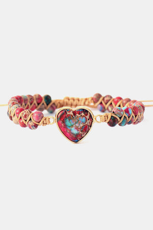 Multicolor beaded bracelet with a heart-shaped stone and gold-tone accents.