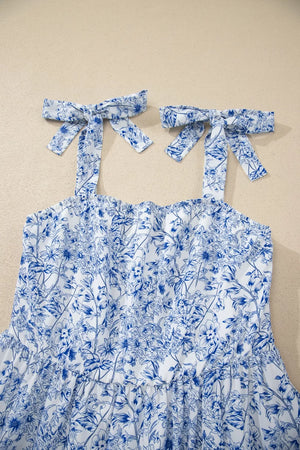 Maxi dress with blue floral print and tie shoulder straps