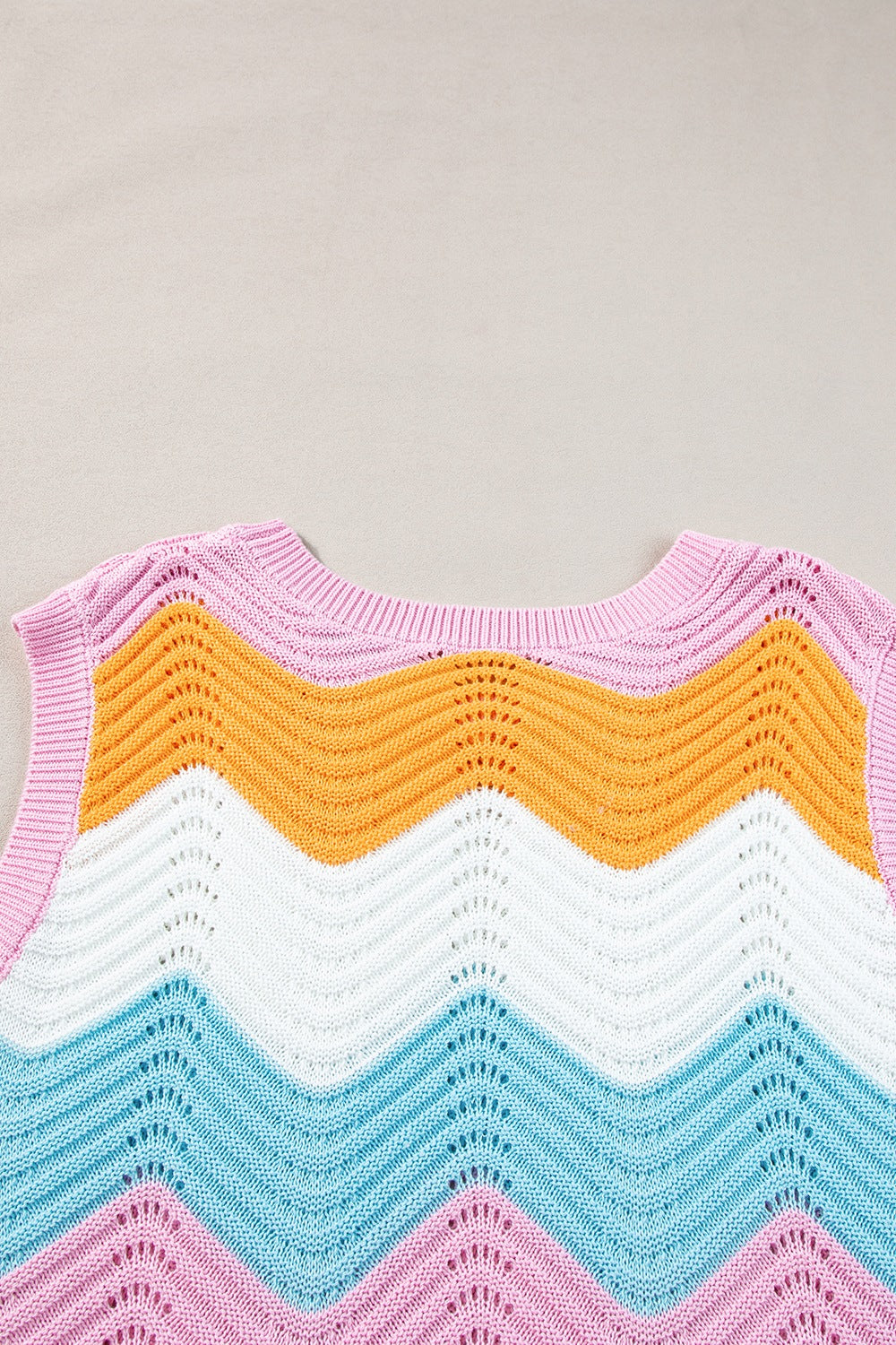 Chevron knit tank top in stripe pattern with open knit details and a crew neck.