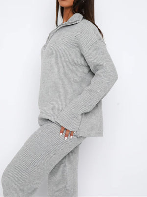 Gray ribbed knit quarter-zip loungewear set with relaxed fit sweater and pants.