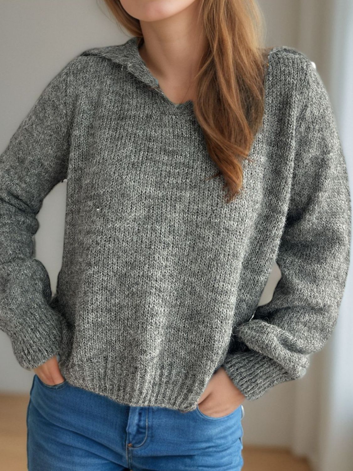 Textured knit polo sweater in dark gray acrylic with a collared neckline and ribbed cuffs.