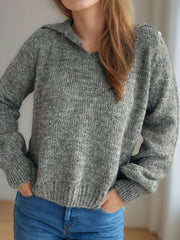 Textured knit polo sweater in dark gray acrylic with a collared neckline and ribbed cuffs.