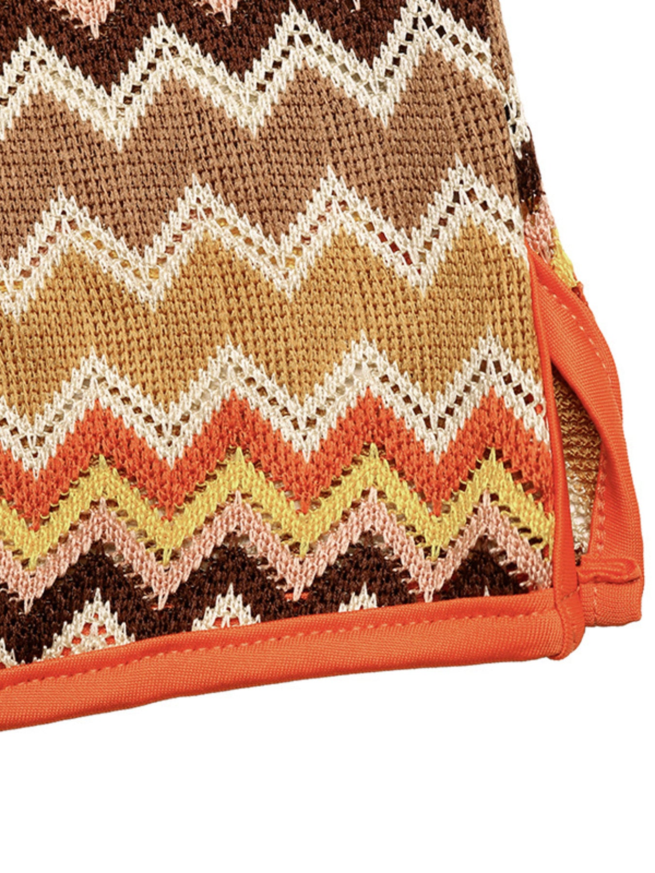 Zigzag knit two-piece set with orange trim and crochet detail.