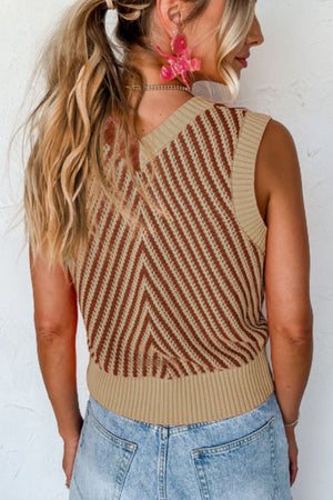 Chevron knit vest in brown and tan with a V-neck and ribbed hem.
