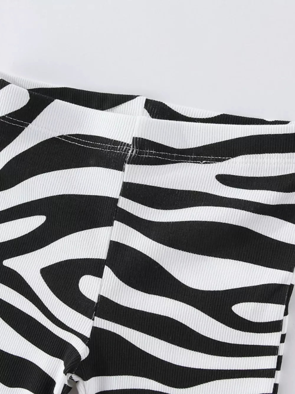 Baby & children's black and white zebra print flare pants with ribbed texture.