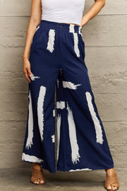 Navy palazzo trousers with white brushstroke pattern and wide leg