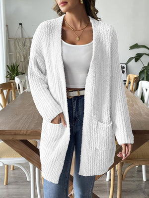 White textured bouclé open-front cardigan with pockets and long sleeves.