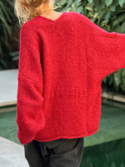 Deep Red bouclé knit oversized cardigan with textured detail on back.