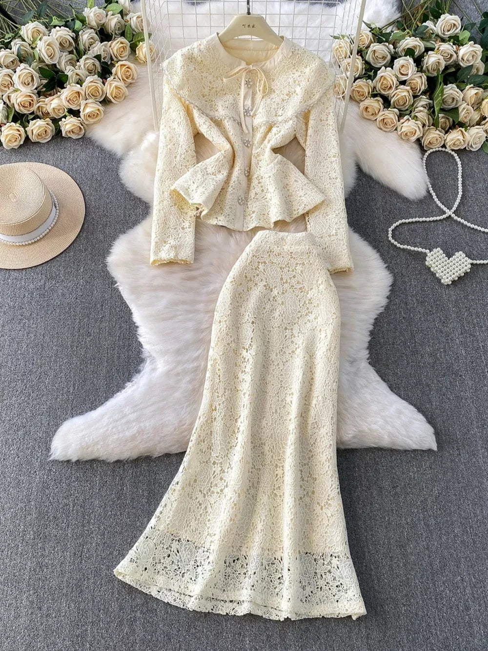 Pastel yellow lace peplum top and maxi skirt set with pearl buttons.