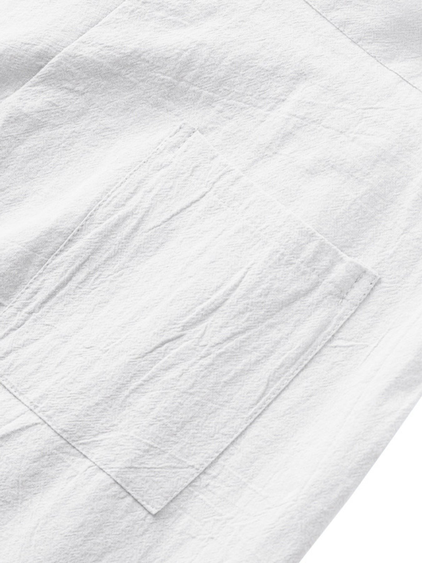 White sweatpants with a textured fabric and a single patch pocket detail.
