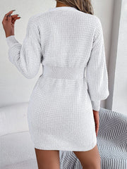 White cable knit dress with button front, long sleeves, and hourglass fit.