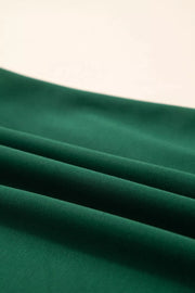 Green polyester t-shirt with relaxed fit and leopard accent detail.