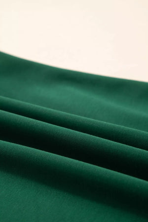 Green polyester t-shirt with relaxed fit and leopard accent detail.