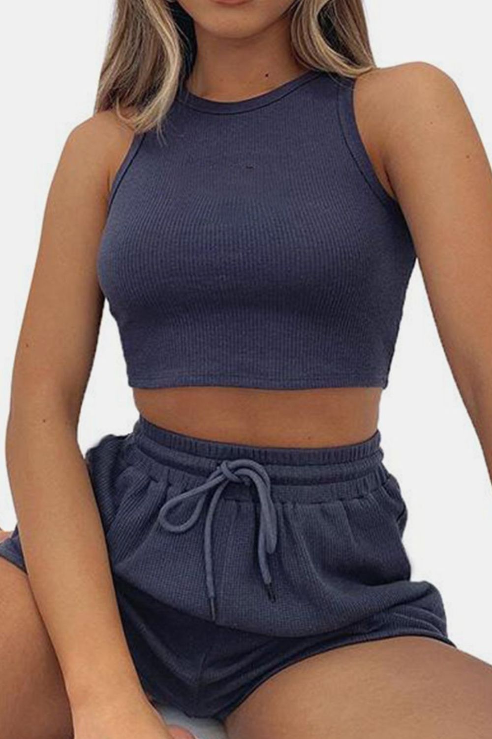Dark blue ribbed knit crop top and drawstring shorts set with a racerback neckline.