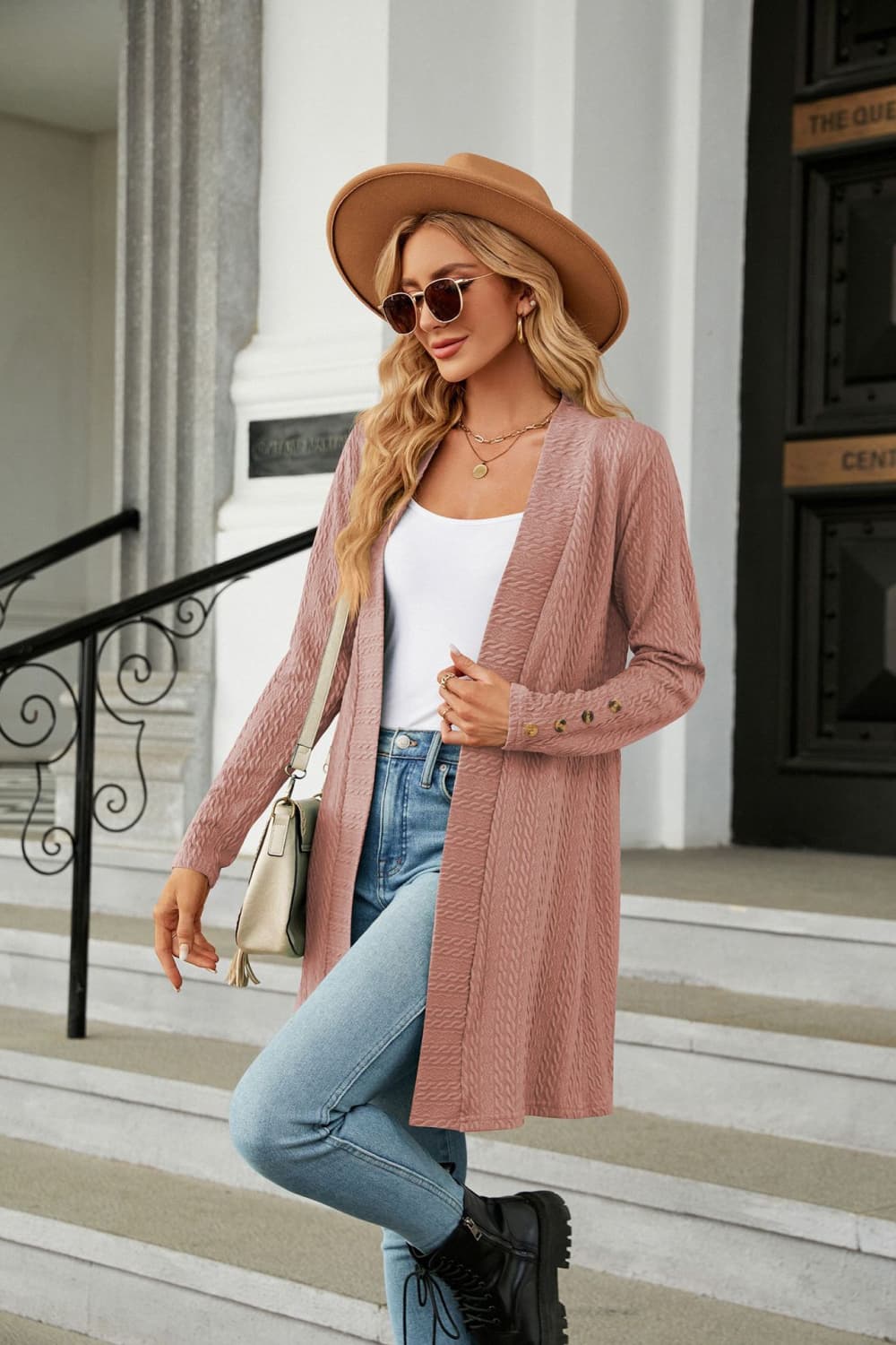 Dusty pink textured knit open-front duster cardigan with button detail on sleeves.