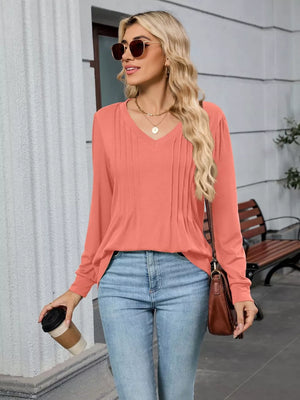 Pink V-neck long sleeve t-shirt with subtle pleating detail.