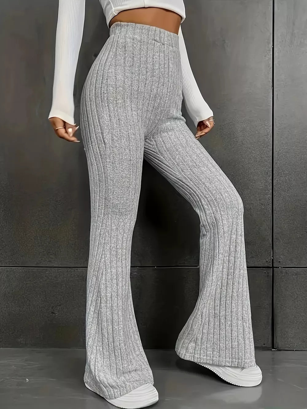 Ribbed high-waist flare maternity pants in grey, featuring a comfortable stretchy fit and wide leg opening.
