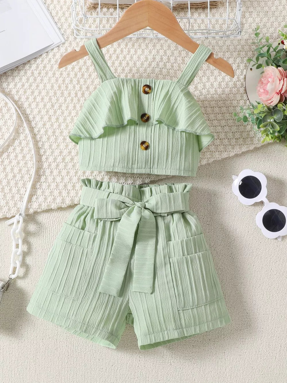 Light Green ruffled ribbed two-piece toddler set with buttoned crop top and belted shorts.