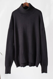 Black relaxed roll-neck sweater with boxy fit and ribbed details