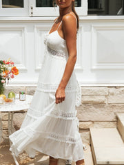 White lace trimmed tiered midi dress with spaghetti straps and empire waist.