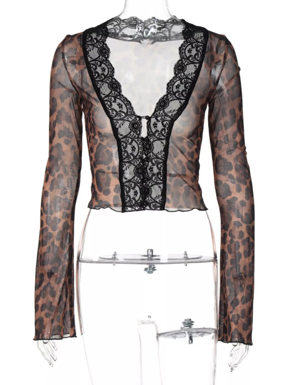 Leopard print sheer sleeve t-shirt with black lace trim and button detail.
