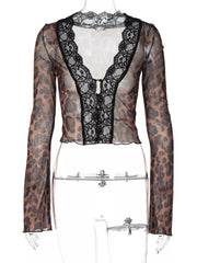 Leopard print sheer sleeve t-shirt with black lace trim and button detail.
