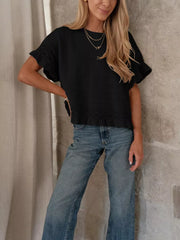 Black knit top with crew neck and delicate lace trim on sleeves and hem