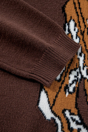 Brown knit sweater with a graphic western pattern and ribbed cuffs.