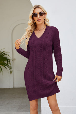 Cable knit bodycon mini dress in magenta with V-neck and long sleeves.