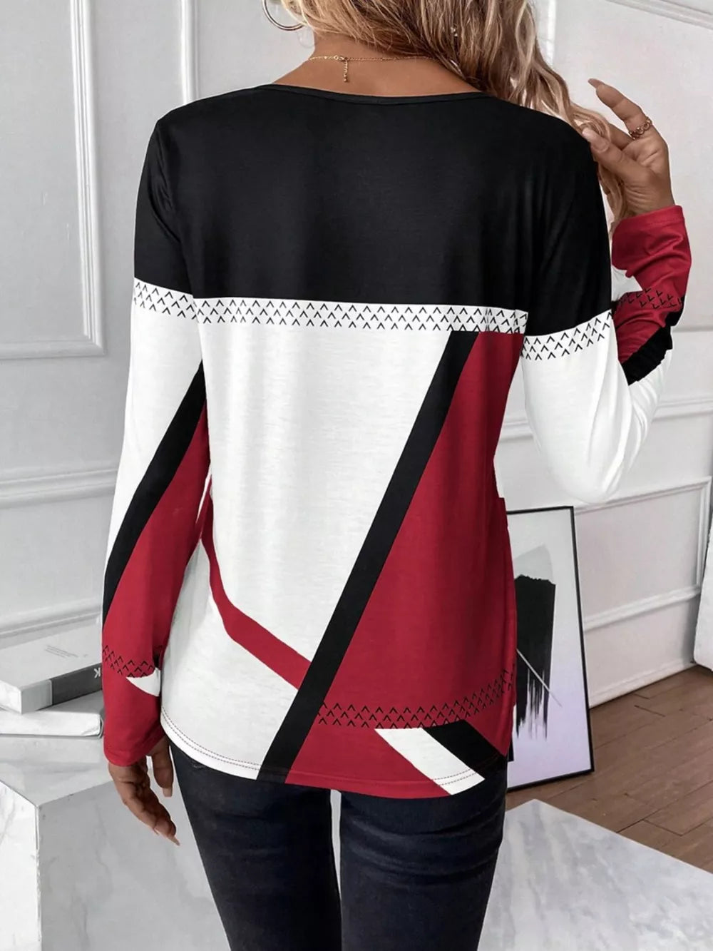 Geometric panel long sleeve t-shirt in white, scarlet, and black with chevron detail.