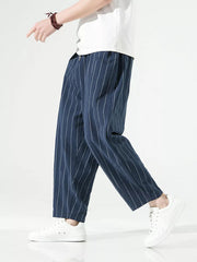 Navy striped relaxed fit sweatpants with drawstring waist and pockets.