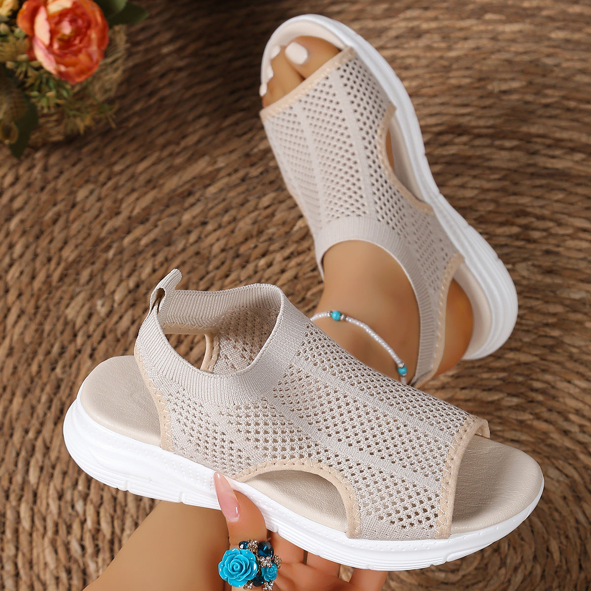 Beige mesh open-toe sandals with a chunky sole and comfortable fit.