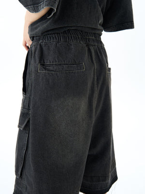Black denim cargo shorts with elastic waist and utility pockets