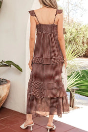 Brown polka dot maxi dress with ruffled tiers and smocked bodice.