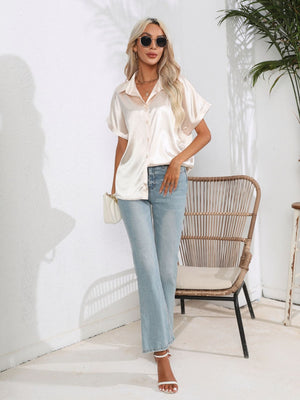 Champagne satin boxy sleeve blouse with button-down front and collar.