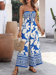 Strapless floral tie-front romper in royal blue with wide legs and a tie detail.